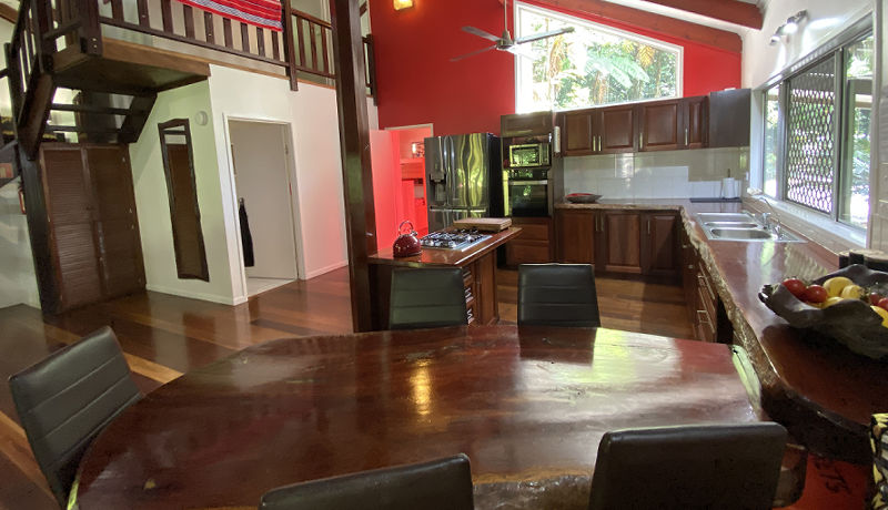 Open Plan Living Spaces Spacious open plan living, dining, and kitchen area inside the Daintree Secrets eco holiday home