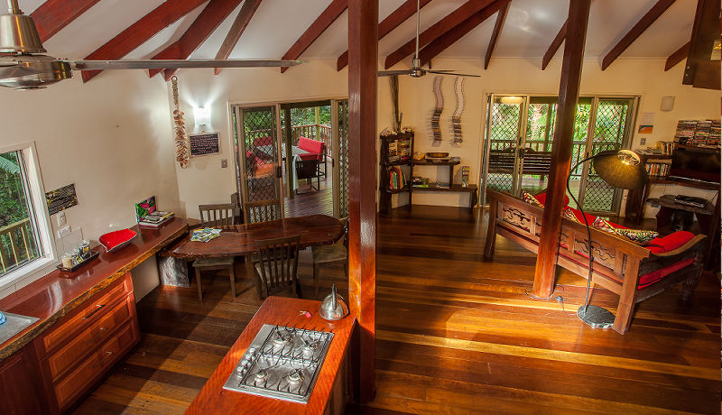 Overhead interior view of the fully equipped open-plan kitchen, dining space, and lounge lounge area