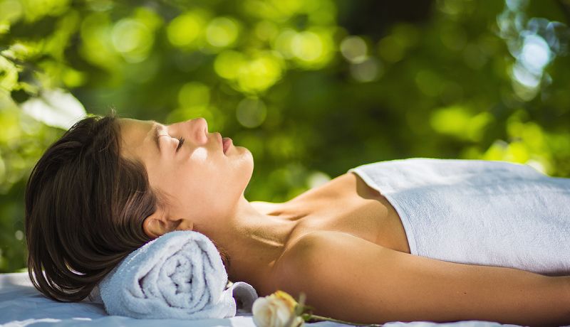 Guest enjoying a relaxing massage treatment booked at a local nearby Daintree day spa