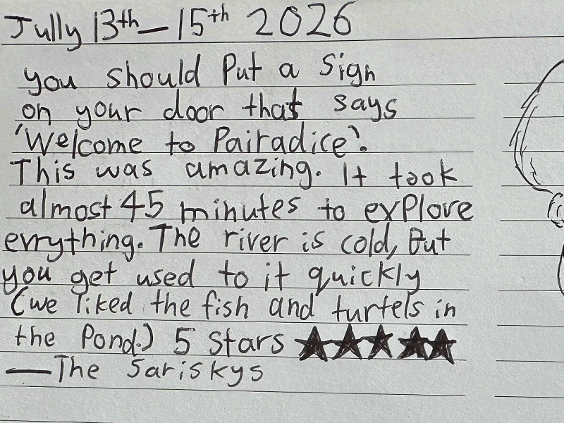 Handwritten guestbook testimonial from July highlighting the private waterfall experience